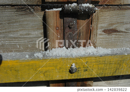 Sea salt crystals gathered on a weathered wooden cart Sea salt crystals gathered on a weathered wooden cart 142839822