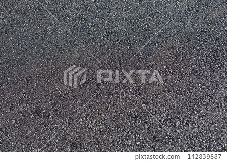 Rough asphalt pavement surface texture Rough asphalt pavement surface texture 142839887