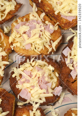 Fried French toast slices with ham and shredded cheese Fried French toast slices with ham and shredded cheese 142839920