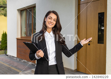 Pretty excited young real estate agent waiting for the clients Pretty excited young real estate agent waiting for the clients 142840220