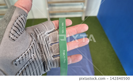 Using resistance band for exercise Using resistance band for exercise 142840500