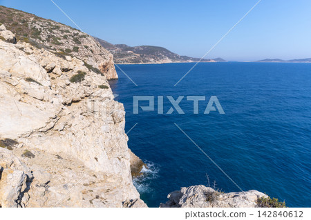 Rocky cliffs of Southern end of Patara beach, Turkey. Coastal landscape Rocky cliffs of Southern end of Patara beach, Turkey. Coastal landscape 142840612