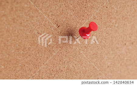 Red thumbtack on corkboard background texture for target reminder and priority note Red thumbtack on corkboard background texture for target reminder and priority note 142840634