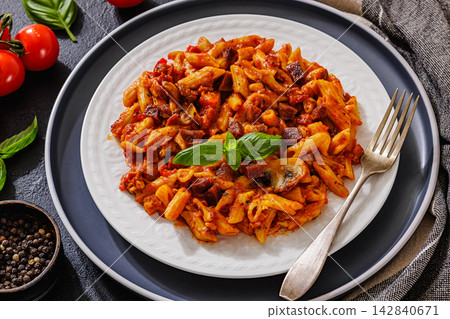 Italian penne dish with diced sausage, mushrooms Italian penne dish with diced sausage, mushrooms 142840671