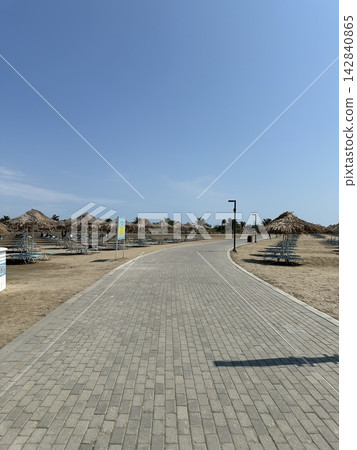 The way to the beach. Bungalow, blue sky, horizon, panorama. The way to the beach. Bungalow, blue sky, horizon, panorama. 142840865