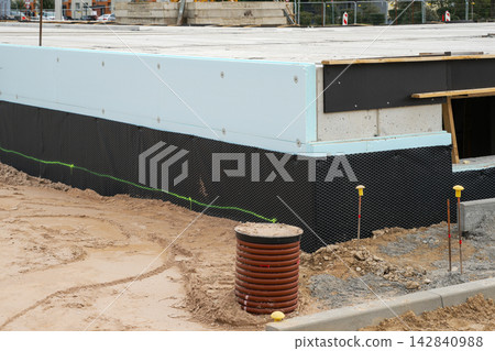 Foundation Waterproofing and Thermal Insulation at Building Construction Site Foundation Waterproofing and Thermal Insulation at Building Construction Site 142840988