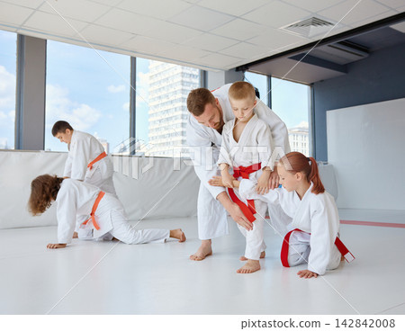Young children show enthusiasm during martial art training Young children show enthusiasm during martial art training 142842008