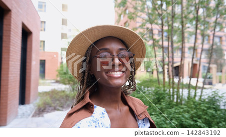 Portrait of a beautiful smiling woman in sunglasses Portrait of a beautiful smiling woman in sunglasses 142843192