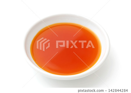 Chili oil in a small dish 142844284