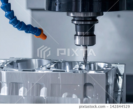 3 axis machining center cuts the engine cylinder block with a solid ball-end mill 142844529