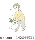 A middle-aged woman struggling with heavy shopping bags. 142844531