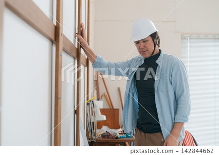 Workers working at construction sites 142844662