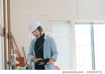 Workers inspecting the interior 142844721