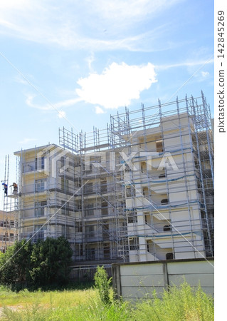 Exterior wall renovation work has begun on the apartment building. Exterior wall renovation work has begun on the apartment building. 142845269