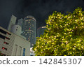 Twin towers lit up at night 142845307