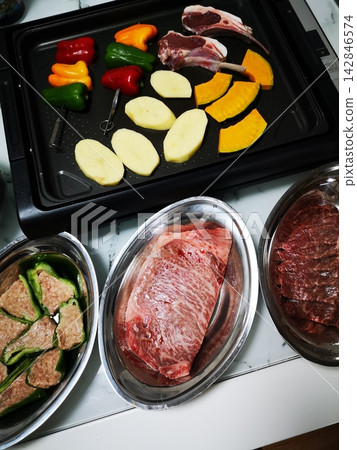 Teppanyaki on a hot plate Teppanyaki on a hot plate 142846574