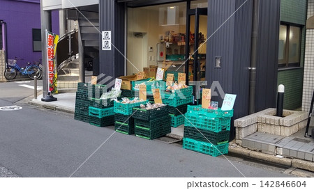 The storefront of a greengrocer or produce shop on a street corner in a residential area The storefront of a greengrocer or produce shop on a street corner in a residential area 142846604