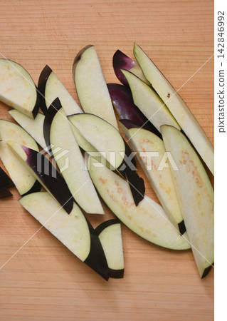 Eggplant cut on a cutting board Eggplant cut on a cutting board 142846992