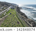 [Aerial view] San'in Main Line Oda-Tagi section and Oda Fishing Port 142848074