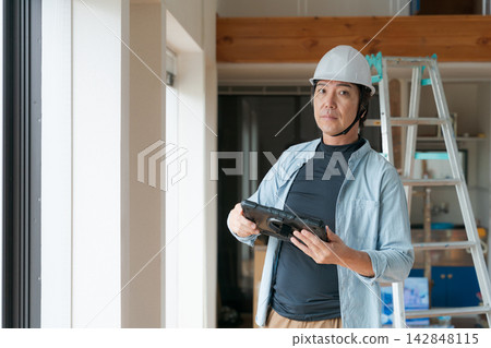 Workers working at construction sites 142848115