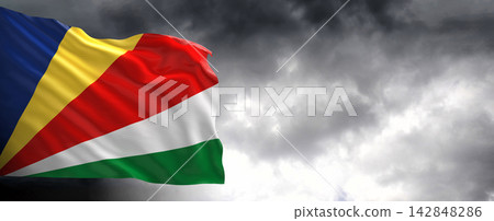 Seychelles Flag Waving Against Dark Cloudy Sky Seychelles Flag Waving Against Dark Cloudy Sky 142848286