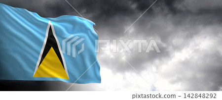 Saint Lucia Flag Waving Against Dark Cloudy Sky Saint Lucia Flag Waving Against Dark Cloudy Sky 142848292