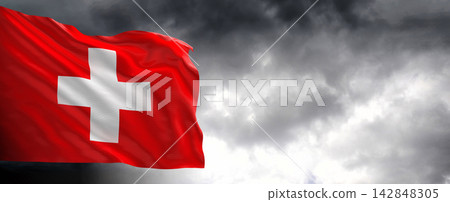 Switzerland Flag Waving Against Dark Cloudy Sky Switzerland Flag Waving Against Dark Cloudy Sky 142848305