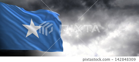 Somalia Flag Waving Against Dark Cloudy Sky Somalia Flag Waving Against Dark Cloudy Sky 142848309