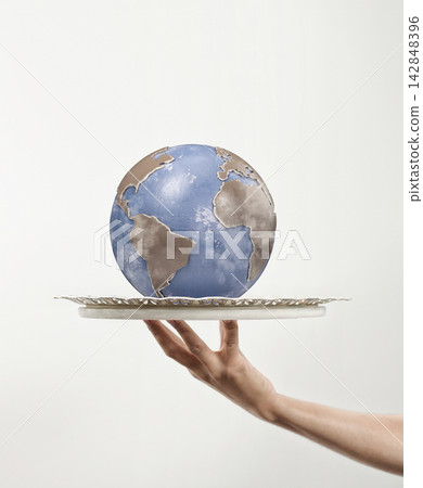 Hand Presenting Globe on Tray Hand Presenting Globe on Tray 142848396