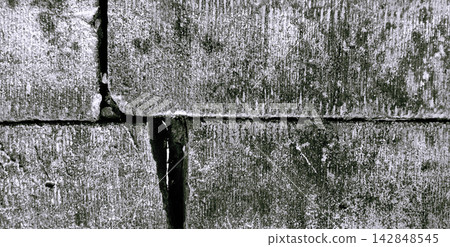 Weathered monochromatic brick wall texture 142848545