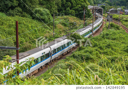 The Limited Express Thunderbird train running between Omi-Shiotsu and Shin-Hikida on the Hokuriku Main Line, in Kutsukake, Nishi-Asai-cho, Nagahama City, Shiga Prefecture. The Limited Express Thunderbird train running between Omi-Shiotsu and Shin-Hikida on the Hokuriku Main Line, in Kutsukake, Nishi-Asai-cho, Nagahama City, Shiga Prefecture. 142849195