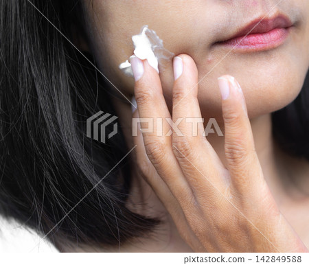 Woman apply lotion cream moisturizer on face, lifestyle clean spa treatment natural aroma therapy wellness skin care, perfec girl skin tan authentic, beauty aesthetic cosmetic product concept. Woman apply lotion cream moisturizer on face, lifestyle clean spa treatment natural aroma therapy wellness skin care, perfec girl skin tan authentic, beauty aesthetic cosmetic product concept. 142849588