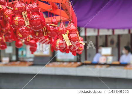 Japan April 29 2026 Red gourd charms hanging at shrine 142849965