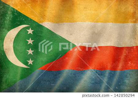 Old vintage flag of Comoros, worn and stained Old vintage flag of Comoros, worn and stained 142850294