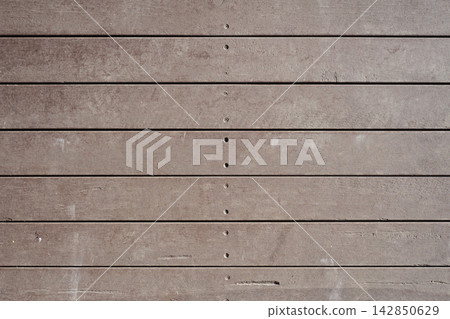 Weathered wooden deck plank texture with screw holes background Weathered wooden deck plank texture with screw holes background 142850629