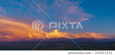 Dramatic Sunset Over Mountain Range in Kyrgyzstan Dramatic Sunset Over Mountain Range in Kyrgyzstan 142851233