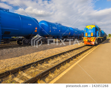 Blue Freight Train with Tank Cars on Tracks in Kyrgyzstan Blue Freight Train with Tank Cars on Tracks in Kyrgyzstan 142851268
