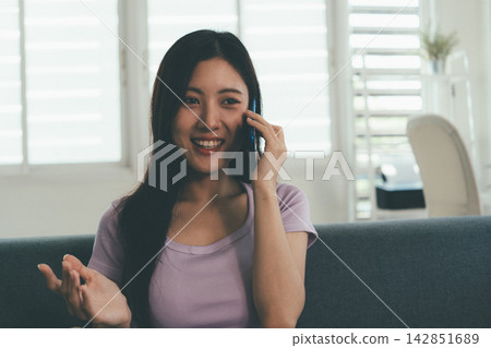 Woman enjoying life at home, promoting healthy eating, wellness, and a balanced lifestyle. Concept of natural nutrition, mindfulness, and modern healthy living. Woman enjoying life at home, promoting healthy eating, wellness, and a balanced lifestyle. Concept of natural nutrition, mindfulness, and modern healthy living. 142851689