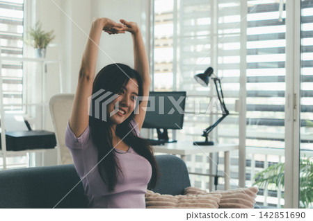 Woman enjoying life at home, promoting healthy eating, wellness, and a balanced lifestyle. Concept of natural nutrition, mindfulness, and modern healthy living. Woman enjoying life at home, promoting healthy eating, wellness, and a balanced lifestyle. Concept of natural nutrition, mindfulness, and modern healthy living. 142851690