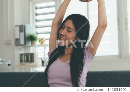 Woman enjoying life at home, promoting healthy eating, wellness, and a balanced lifestyle. Concept of natural nutrition, mindfulness, and modern healthy living. Woman enjoying life at home, promoting healthy eating, wellness, and a balanced lifestyle. Concept of natural nutrition, mindfulness, and modern healthy living. 142851691