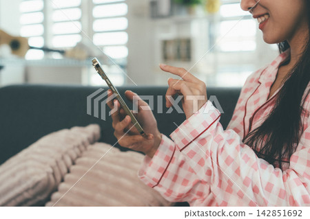Woman enjoying life at home, promoting healthy eating, wellness, and a balanced lifestyle. Concept of natural nutrition, mindfulness, and modern healthy living. 142851692
