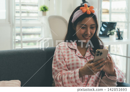 Woman enjoying life at home, promoting healthy eating, wellness, and a balanced lifestyle. Concept of natural nutrition, mindfulness, and modern healthy living. Woman enjoying life at home, promoting healthy eating, wellness, and a balanced lifestyle. Concept of natural nutrition, mindfulness, and modern healthy living. 142851693