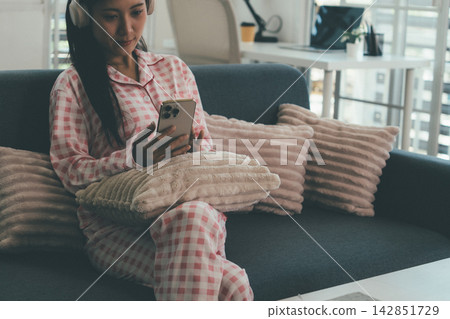 Woman enjoying life at home, promoting healthy eating, wellness, and a balanced lifestyle. Concept of natural nutrition, mindfulness, and modern healthy living. Woman enjoying life at home, promoting healthy eating, wellness, and a balanced lifestyle. Concept of natural nutrition, mindfulness, and modern healthy living. 142851729