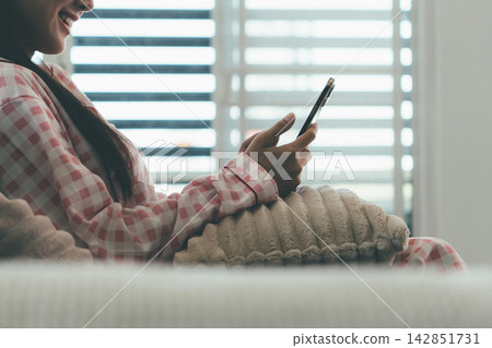 Woman enjoying life at home, promoting healthy eating, wellness, and a balanced lifestyle. Concept of natural nutrition, mindfulness, and modern healthy living. Woman enjoying life at home, promoting healthy eating, wellness, and a balanced lifestyle. Concept of natural nutrition, mindfulness, and modern healthy living. 142851731