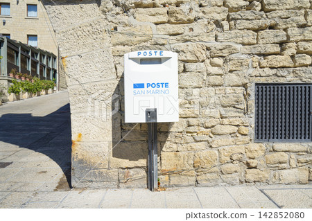 San Marino post box mounted on a rough stone wall. San Marino post box mounted on a rough stone wall. 142852080