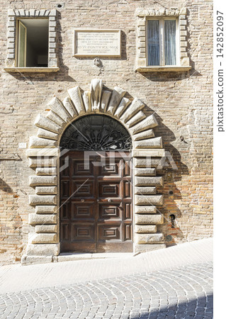 An ornate wooden door in Urbino, Italy An ornate wooden door in Urbino, Italy 142852097