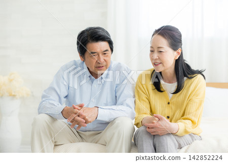 Senior middle-aged couple in the living room Senior middle-aged couple in the living room 142852224