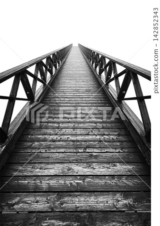 A wooden boardwalk A wooden boardwalk 142852343