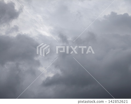 Illuminated Street Lamp Against Overcast Sky 142852621