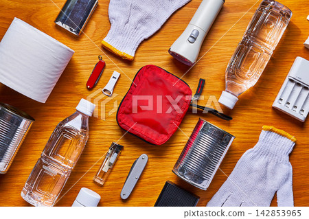 Disaster preparedness supplies on a wooden table Disaster preparedness supplies on a wooden table 142853965